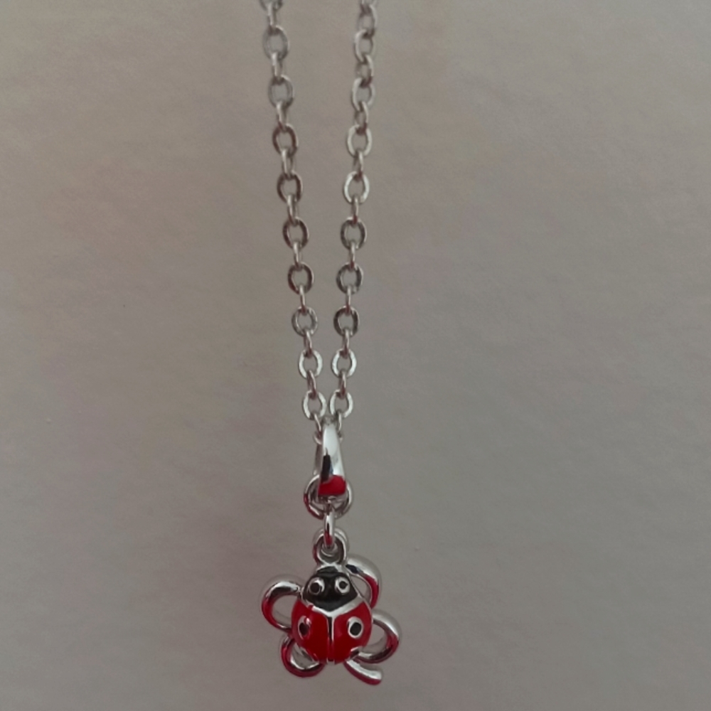 Ladybug on a shamrock necklace with 16" chain